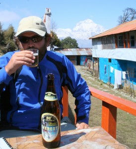 Relaxing- enjoying a well earned "Everest" Beer on the Annapurna Circuit in Nepal 2007